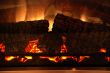 fire-place with a fire and logs