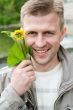 man with dandelion