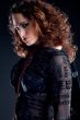 Woman with long curly hair looking confident
