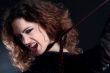 Woman with long curly hair in extasy
