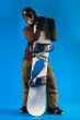 Woman with long curly hair presenting her snowboard