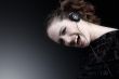 Woman with long curly hair enjoying nusic