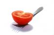 Fork and ripe tomato