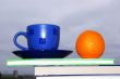 Orange, cup and  books