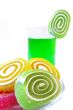 Multi-coloured fruit candy  and cold green drink