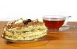 Cup of tea, spoon and cake