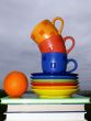 Cups, books and orange