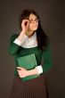 Businesswoman holding her glasses