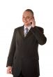 Laughing businessman calling on phone
