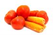 Juicy tomatos with carrot close-up