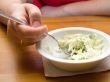 Woman eating salad