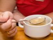 Woman eating soup