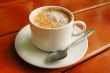Cappuccino cup with metal spoon