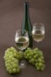 White wine with bottle, glasses and grapes