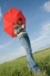 woman under red umbrella