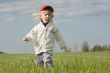 little girl on green meadow