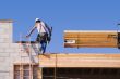 Carpenter Climbing Up Ladder