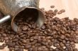 Cezve and roasted coffee beans on the table