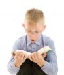 Amazed boy reading very interesting book