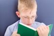 Boy reading interesting book