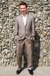 man against a granite wall