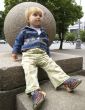 Girl sits near a sphere