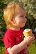 Little girl eats ice-cream