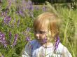 Little girl and field flowers