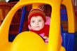 Little girl in the carriage  in a supermarket