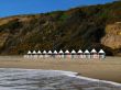 beach huts at cliff bottom