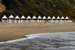 beach huts and incoming tide
