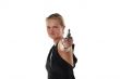 young blond woman with revolver isolated on white background