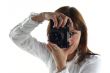 young woman with old camera isolated on white background