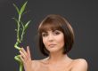 brunette with bamboo over grey
