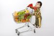 Baby pushes a shopping cart
