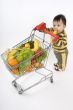 Baby pushes a shopping cart