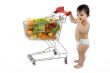 Baby pushes a shopping cart