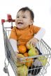 Baby pushes a shopping cart