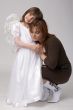 toddler in angel dress with her mother