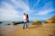 loving couple hugging each other on the summer beach