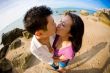 young couple kissing on the beach
