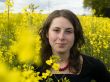 Yellow rape field and young girl