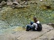 Young girl on the stone