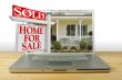 Sold Home For Sale Sign on Laptop