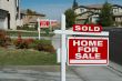Sold Home For Sale Sign & New House