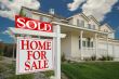 Sold Home For Sale Sign & New House