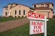 Sold Home For Sale Sign & New House