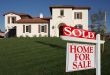 Sold Home For Sale Sign & New House
