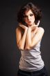 brunette girl posing on dark background