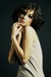 brunette girl posing on dark background